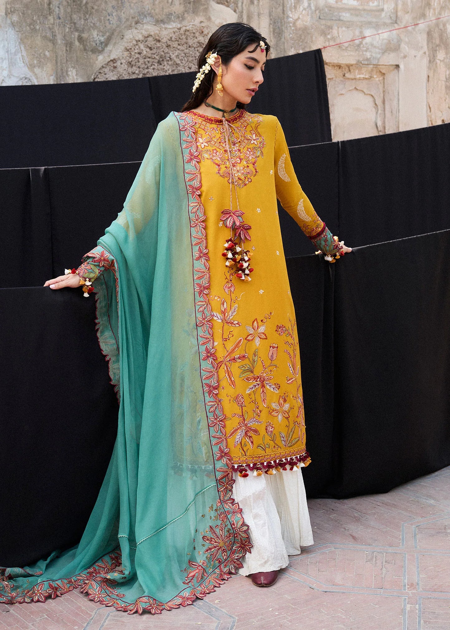 Model wearing mustard and teal Masam from Hussain Rehar Nirmal SS '25, Pakistani luxury pret and Pakistani clothes online in UK.
