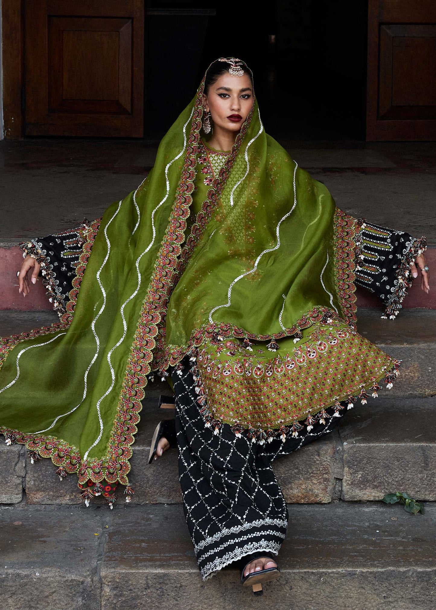 Model wearing Hussain Rehar Luxury Lawn '25 Abass in olive green with intricate embroidery. Shop Pakistani luxury pret online in the UK.