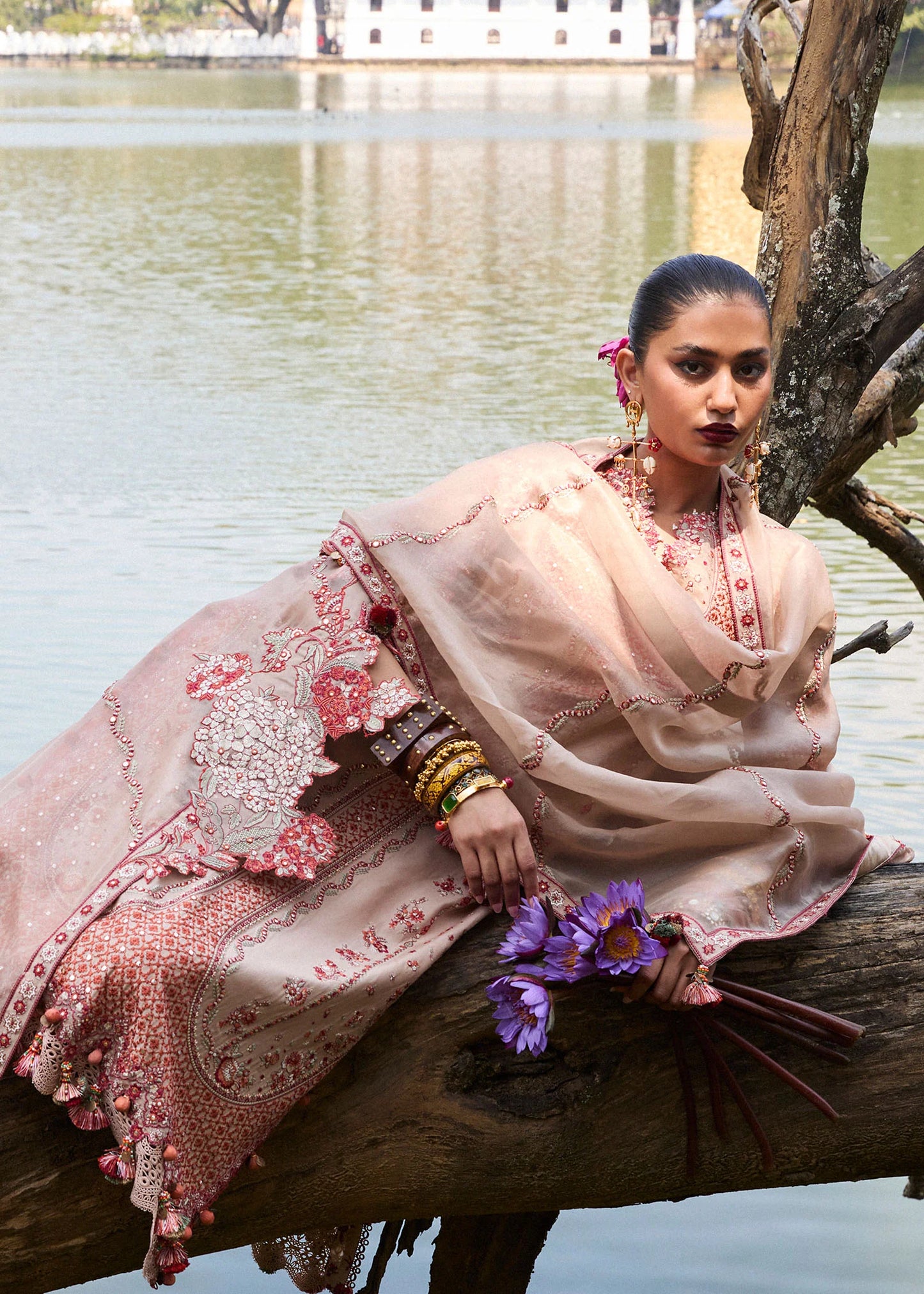 Model wearing Hussain Rehar Luxury Lawn '25 Mari in beige with red embroidery. Shop Pakistani luxury pret online in the UK.