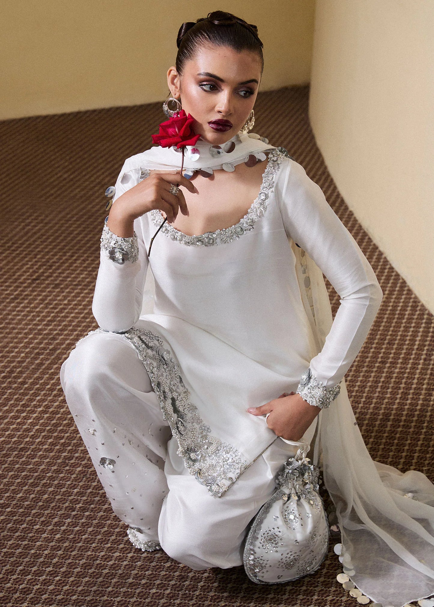 Model wearing Hussain Rehar SS Luxury Pret '25 Swoon in white with silver embellishments. Shop Pakistani luxury pret online in the UK.