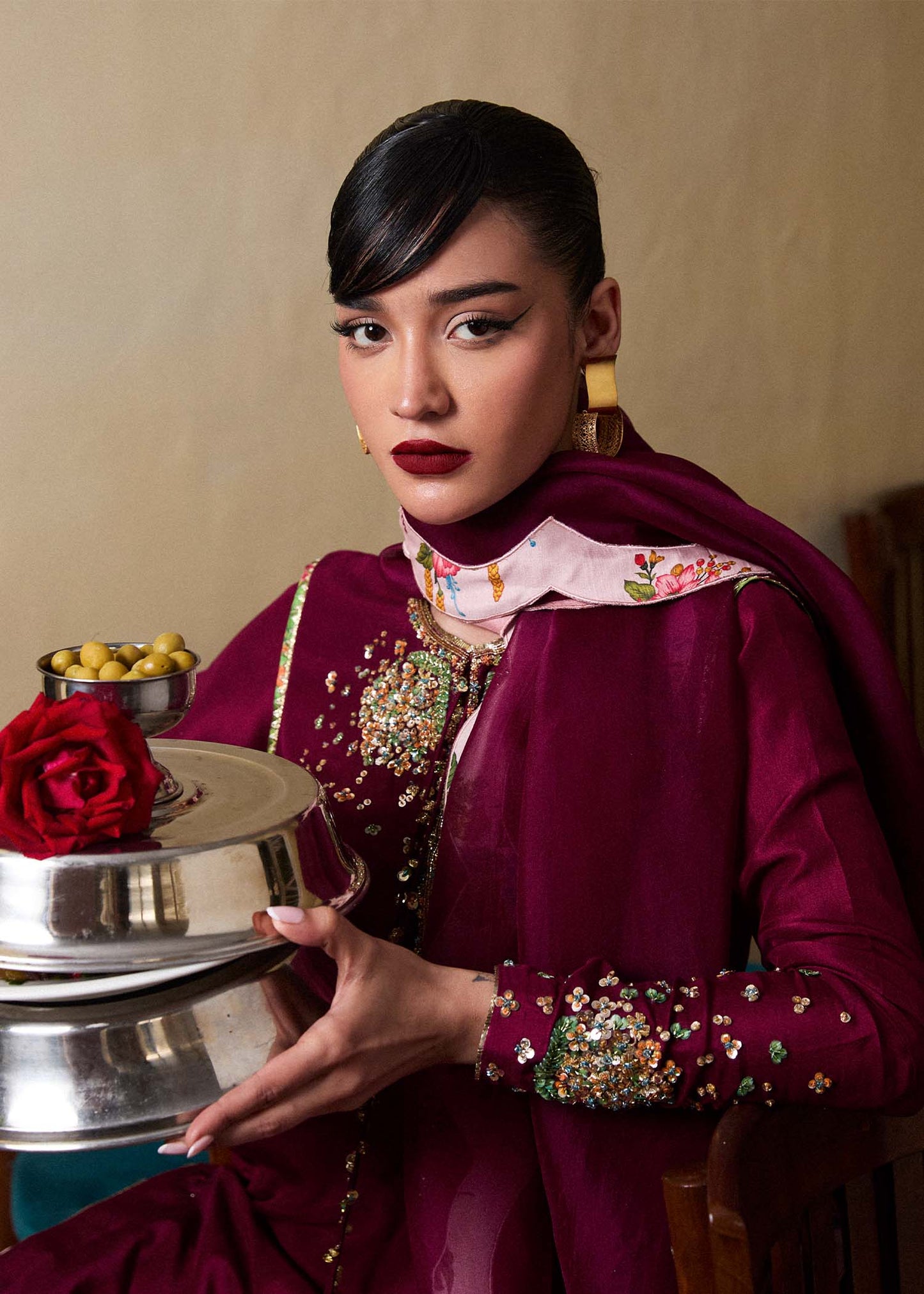 Model wearing Hussain Rehar SS Luxury Pret '25 Impel in deep plum with pink floral trousers. Shop Pakistani luxury pret online in the UK.