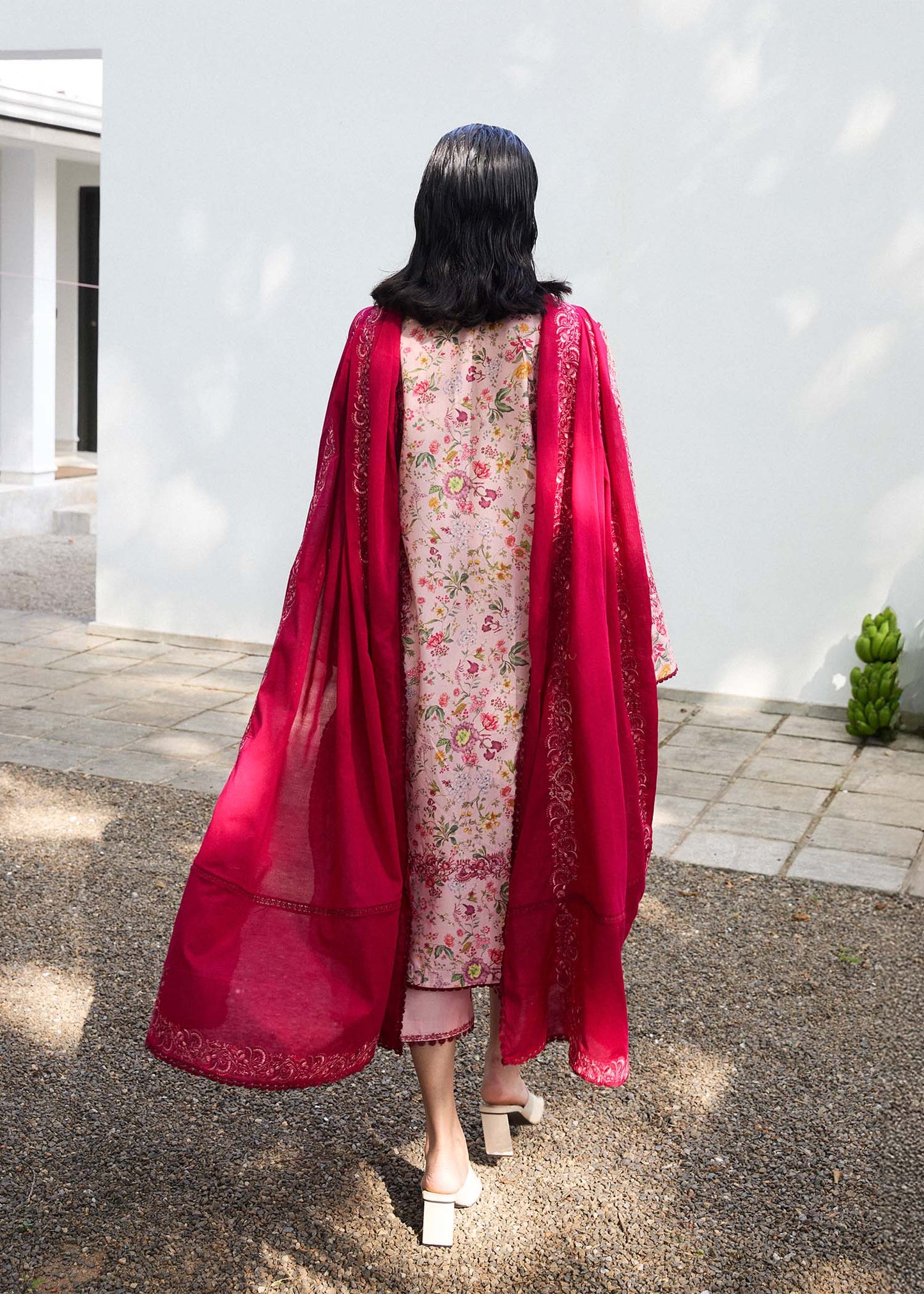 Model wearing pink floral Darla dress from Hussain Rehar Pret SS '25, showcasing Pakistani luxury pret and Pakistani clothes online in UK.
