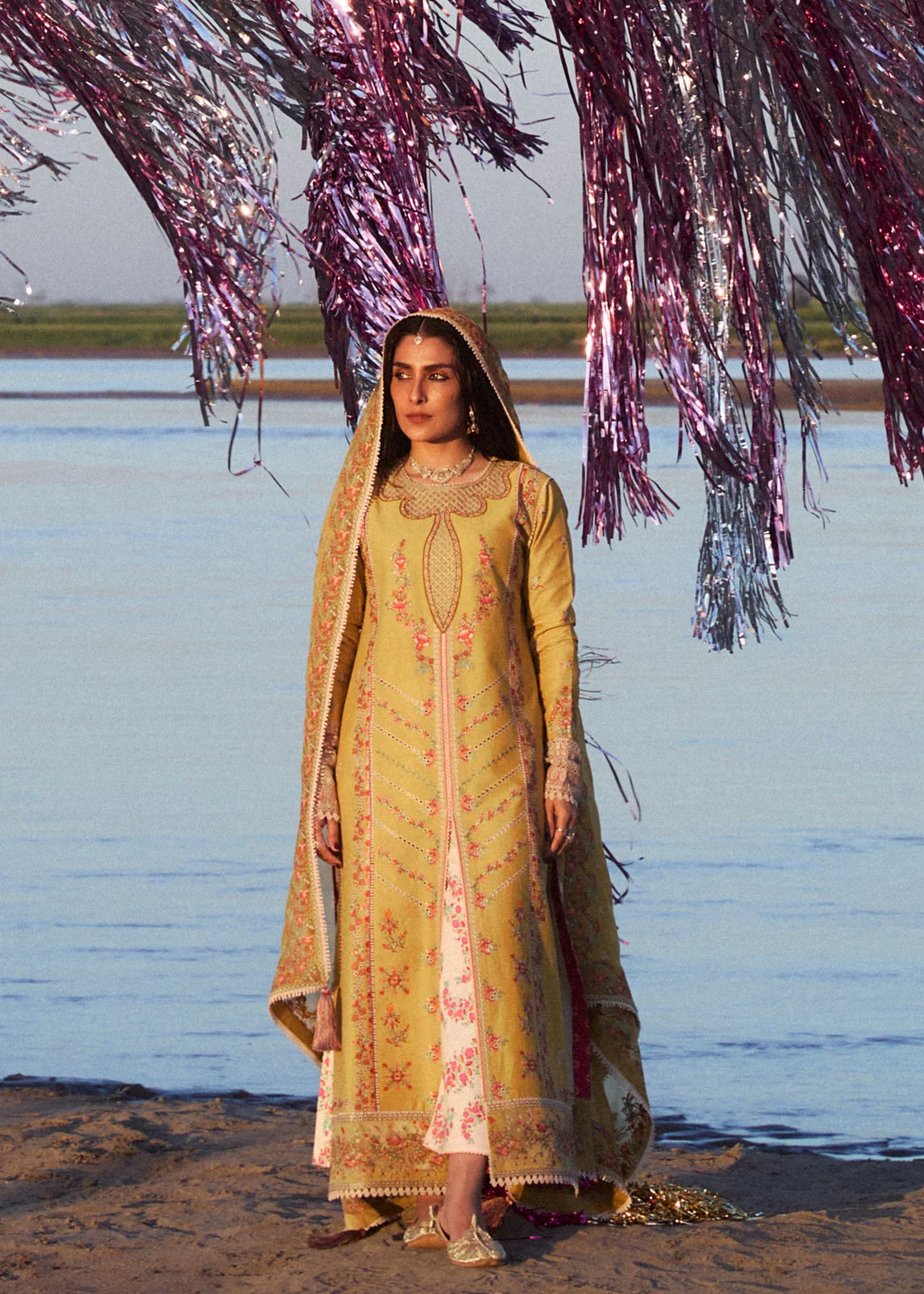 Model wearing mustard and ivory Soana dress from Hussain Rehar, showcasing Pakistani luxury pret and Pakistani clothes online in UK.