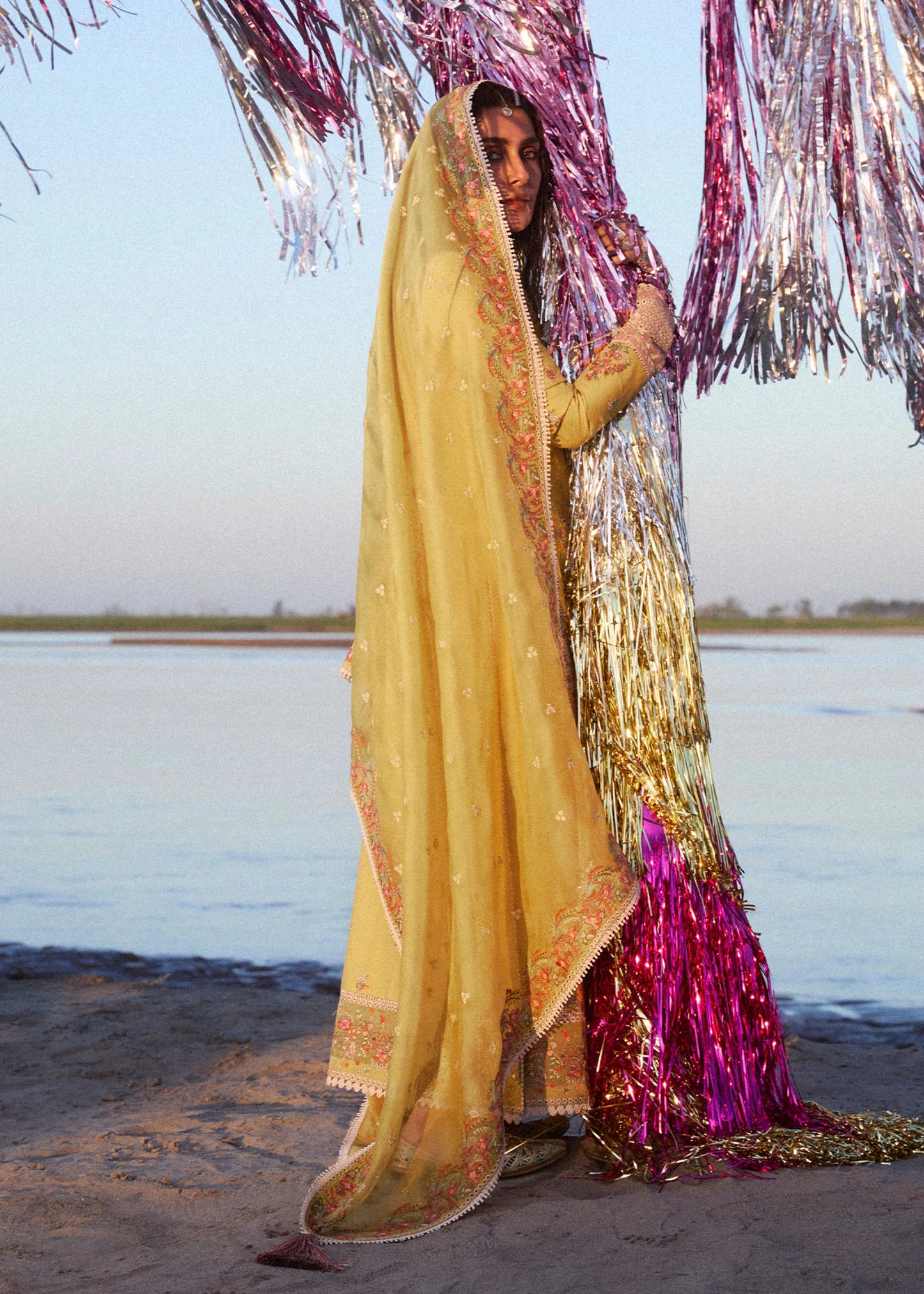 Model wearing mustard and ivory Soana dress from Hussain Rehar, showcasing Pakistani luxury pret and Pakistani clothes online in UK.