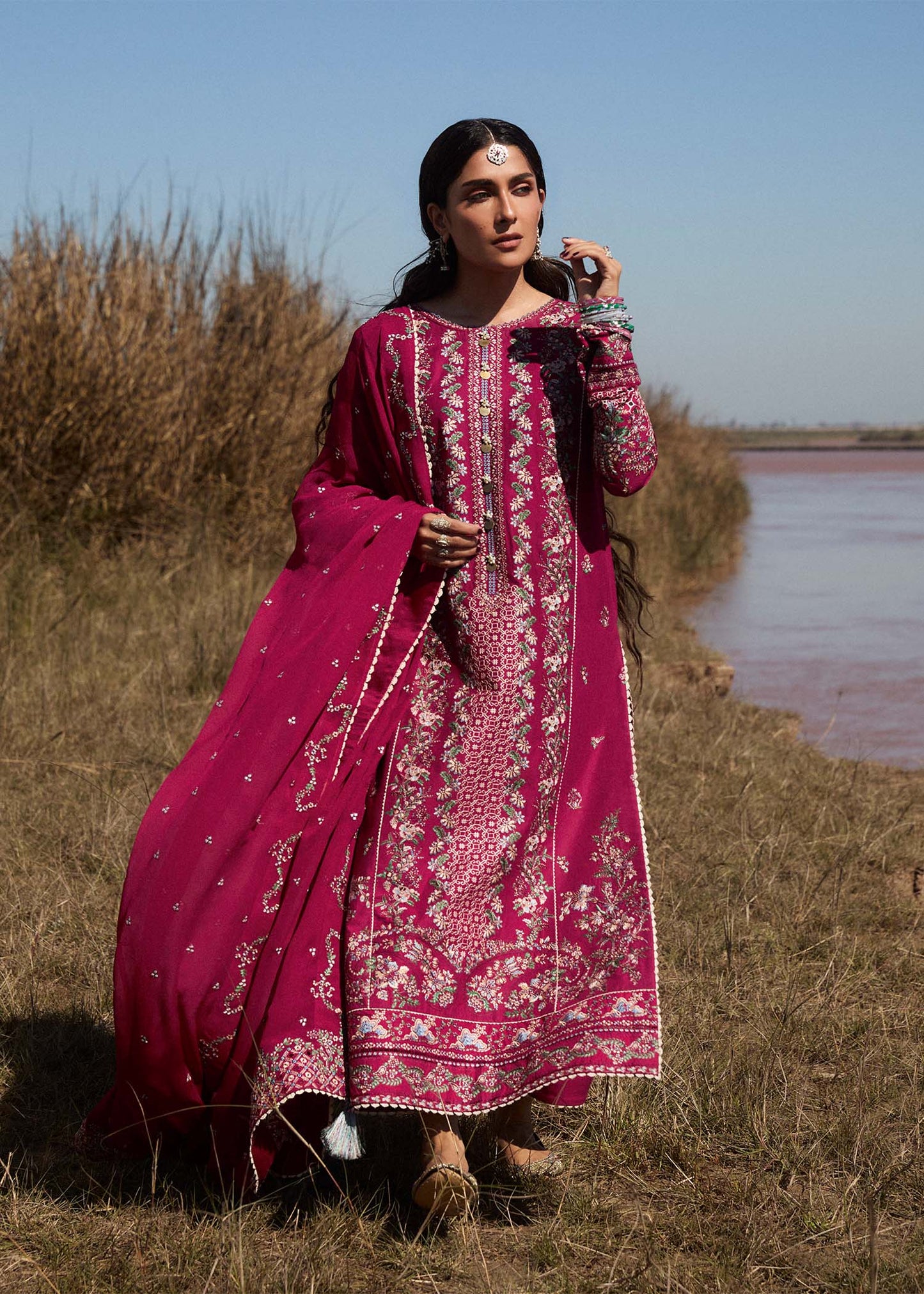 Model wearing deep pink embroidered dress Mehrunisa by Hussain Rehar, Pakistani luxury pret online in UK.