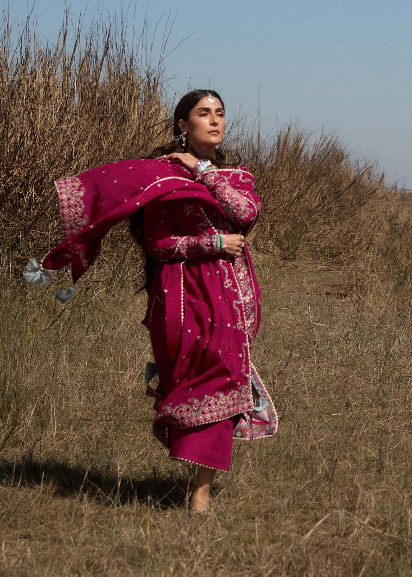 Model wearing deep pink embroidered dress Mehrunisa by Hussain Rehar, Pakistani luxury pret online in UK.
