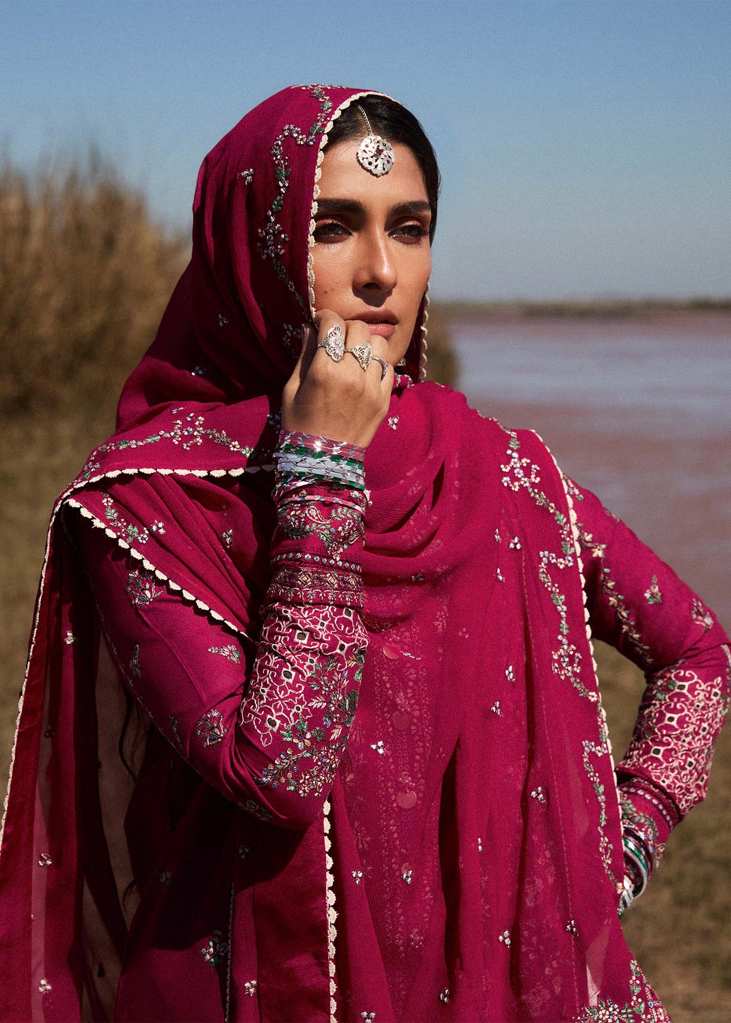 Model wearing deep pink embroidered dress Mehrunisa by Hussain Rehar, Pakistani luxury pret online in UK.