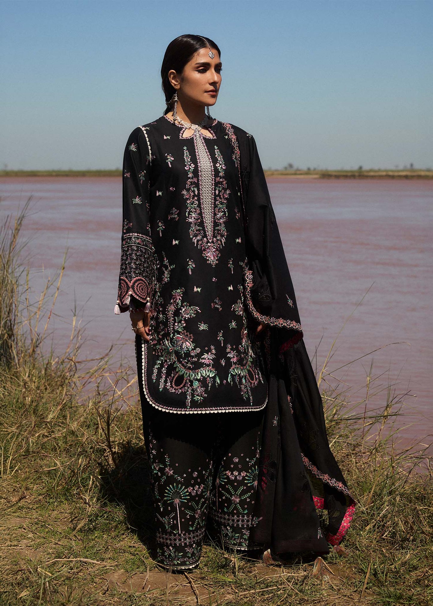 Model wearing black dress Siyah by Hussain Rehar, Pakistani luxury pret online in UK for festive wear and Eid.