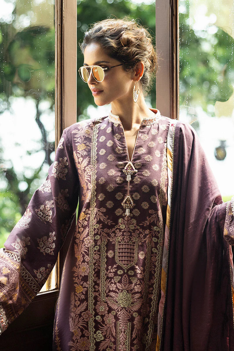 Model wearing deep plum and gold Narissa dress from Mushq Seraph Jacquard Lawn '25, Pakistani Luxury pret, Pakistani clothes online in UK.