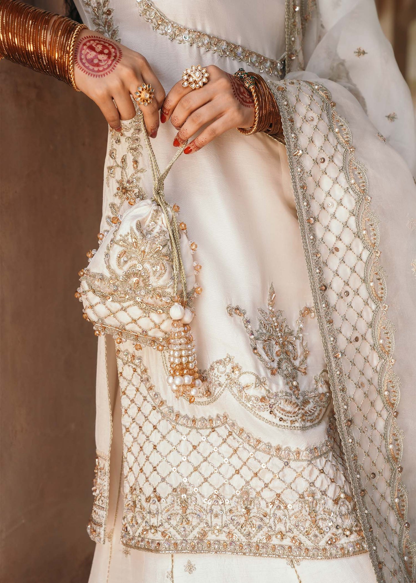 Model wearing Jaya by Kanwal Malik in ivory with gold embellishments – timeless Pakistani luxury pret outfit in UK.