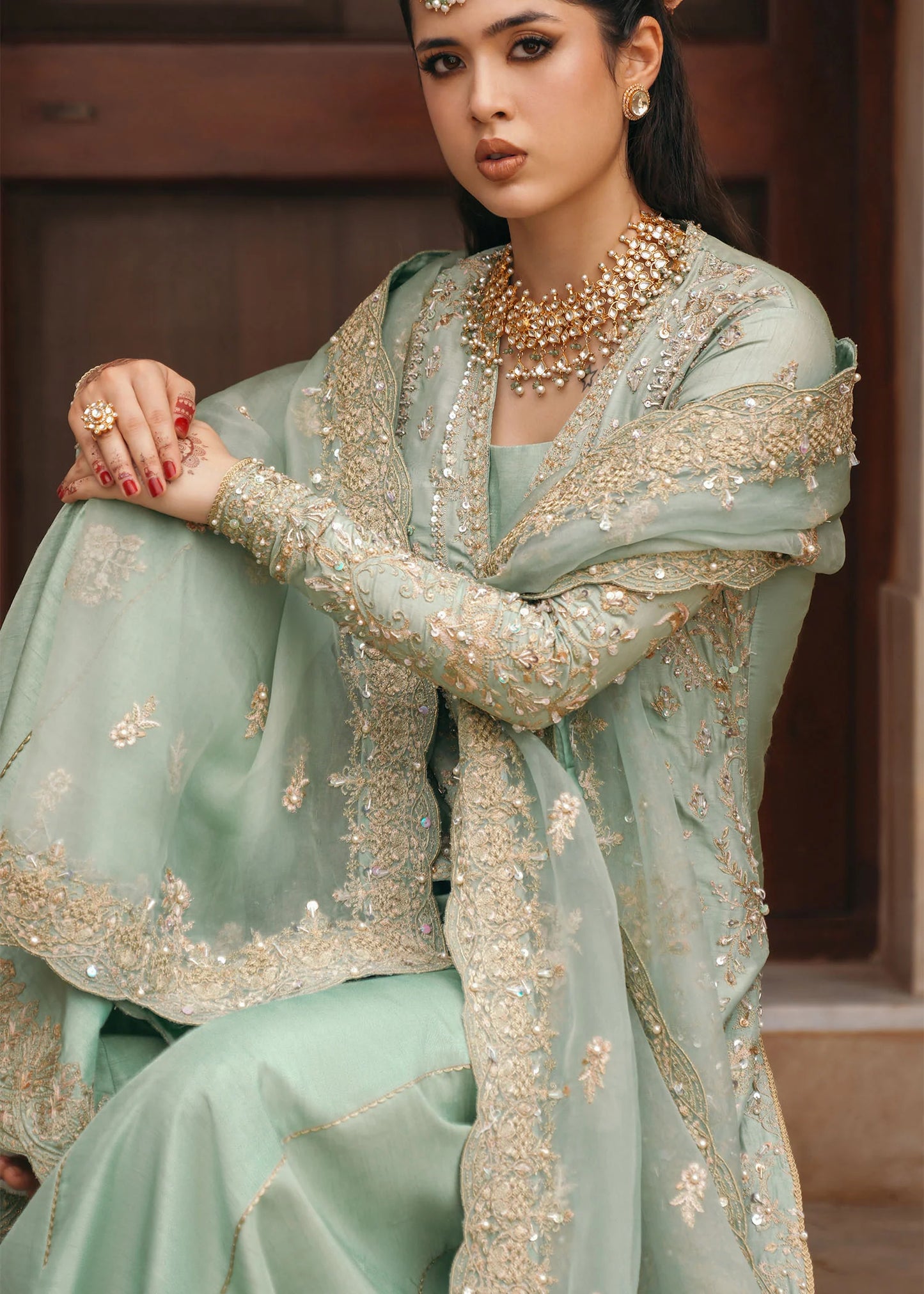 Model wearing Kaneez by Kanwal Malik in mint green with gold embroidery – luxurious Pakistani luxury pret outfit in UK.