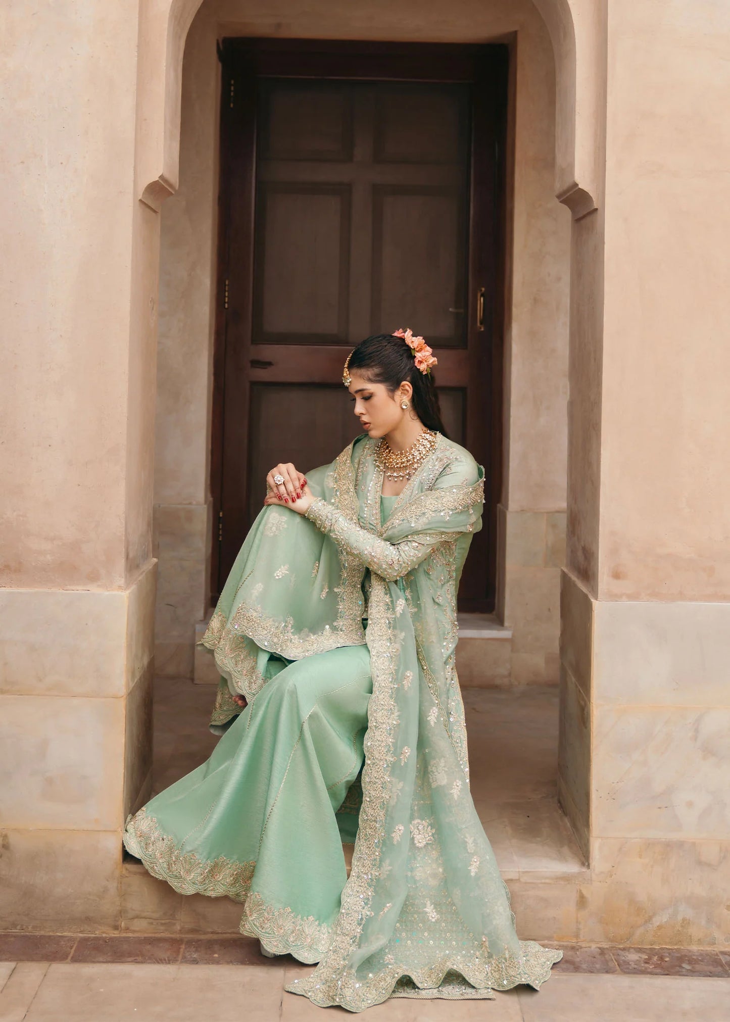 Model wearing Kaneez by Kanwal Malik in mint green with gold embroidery – luxurious Pakistani luxury pret outfit in UK.
