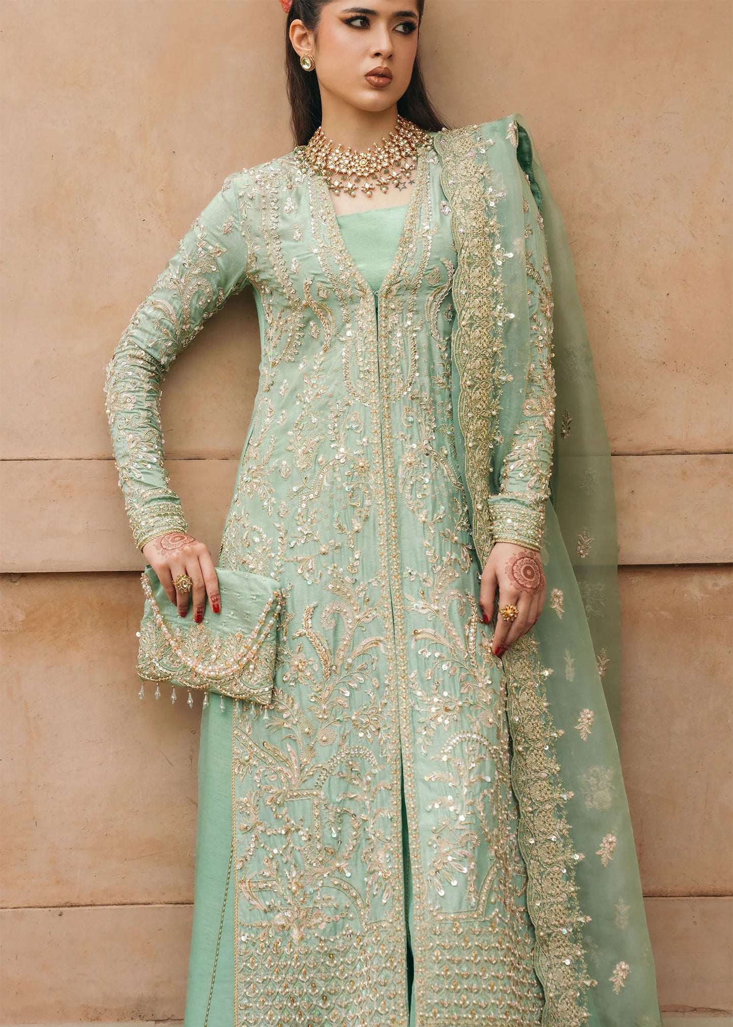 Model wearing Kaneez by Kanwal Malik in mint green with gold embroidery – luxurious Pakistani luxury pret outfit in UK.