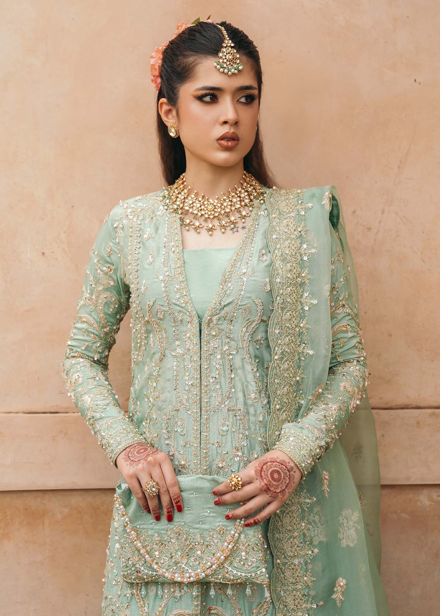 Model wearing Kaneez by Kanwal Malik in mint green with gold embroidery – luxurious Pakistani luxury pret outfit in UK.