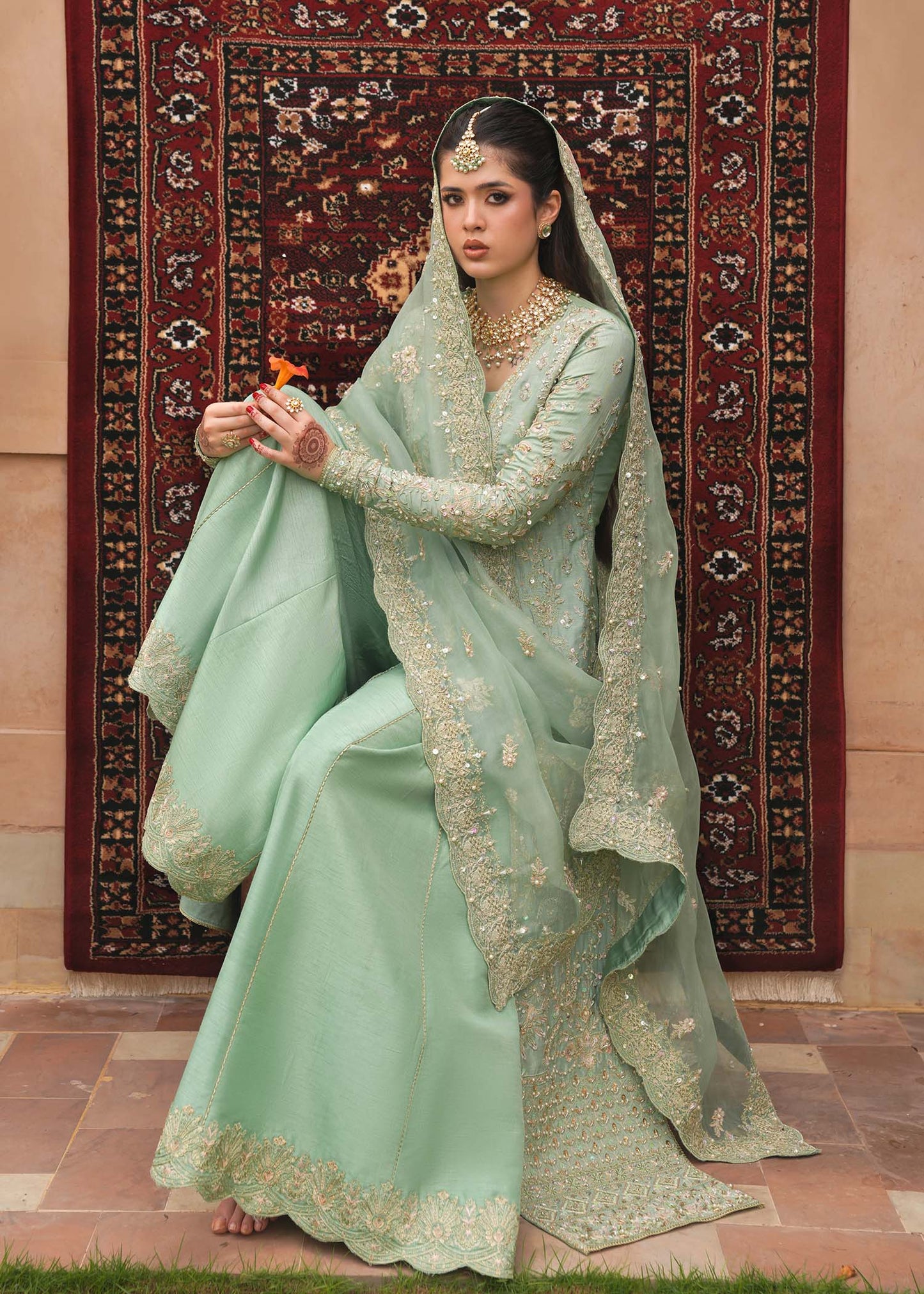 Model wearing Kaneez by Kanwal Malik in mint green with gold embroidery – luxurious Pakistani luxury pret outfit in UK.