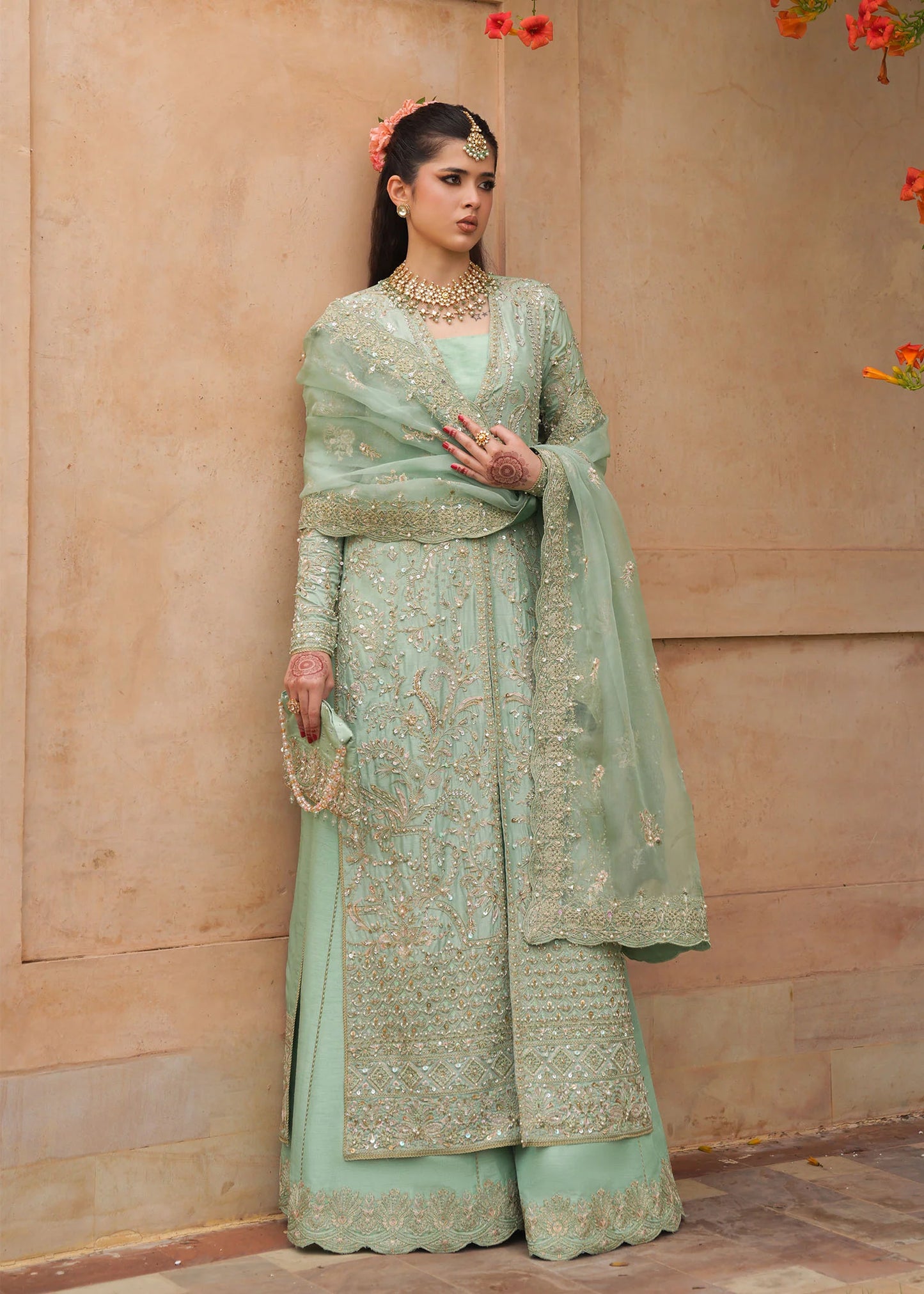 Model wearing Kaneez by Kanwal Malik in mint green with gold embroidery – luxurious Pakistani luxury pret outfit in UK.