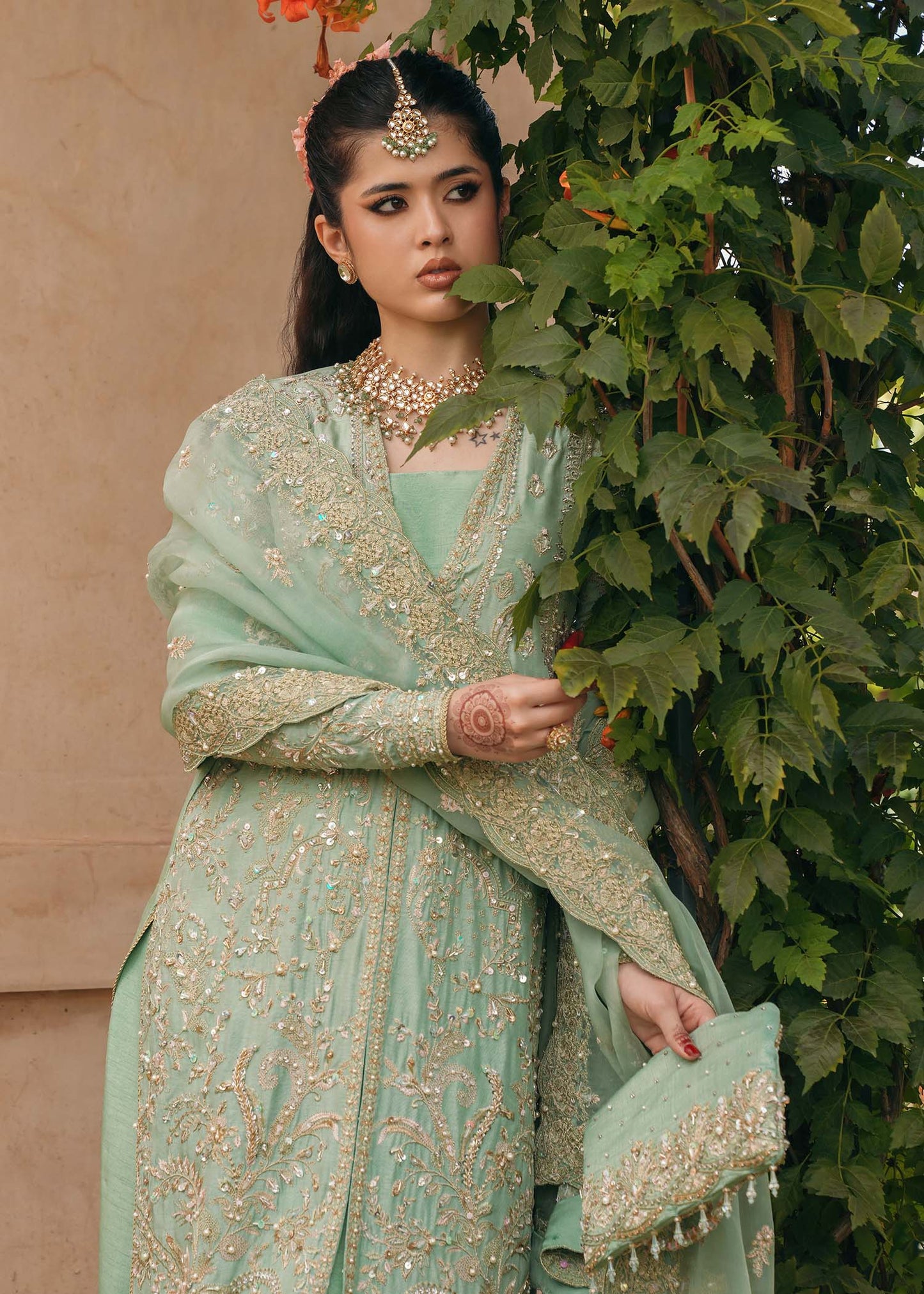 Model wearing Kaneez by Kanwal Malik in mint green with gold embroidery – luxurious Pakistani luxury pret outfit in UK.