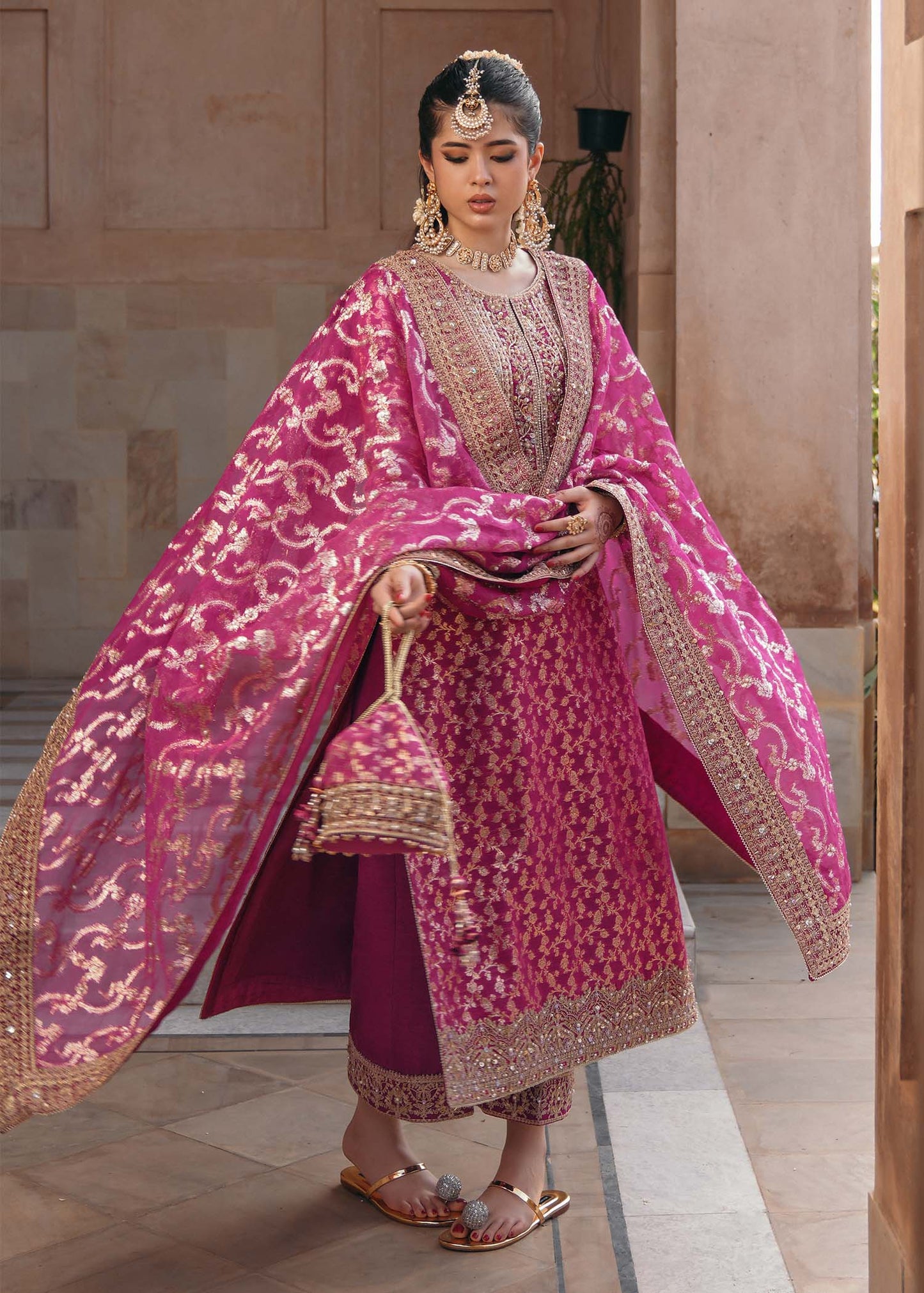 Model wearing Rano by Kanwal Malik in hot pink with intricate gold detailing – vibrant Pakistani luxury pret outfit in UK.