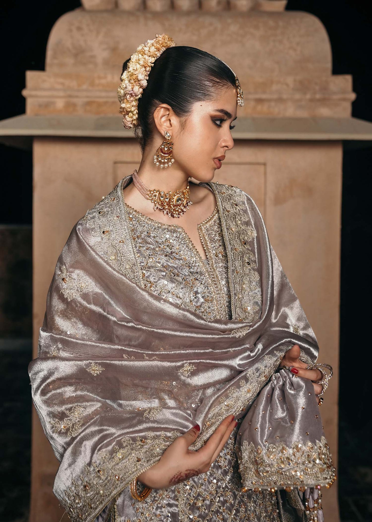 Model wearing Gulnaar by Kanwal Malik in metallic silver with intricate embellishments – elegant Pakistani luxury pret outfit in UK.