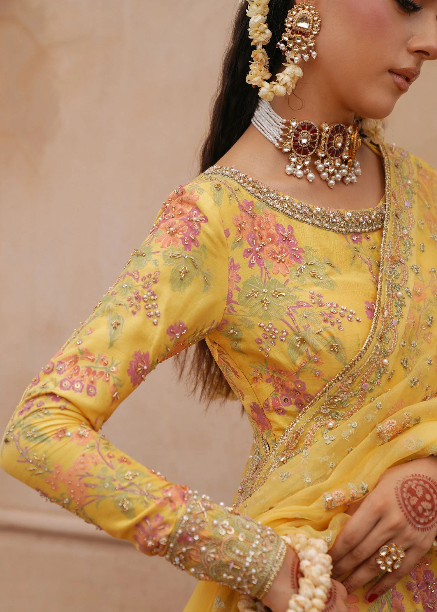 Model wearing Hoorain by Kanwal Malik in vibrant yellow with floral embroidery – festive Pakistani luxury pret outfit in UK.