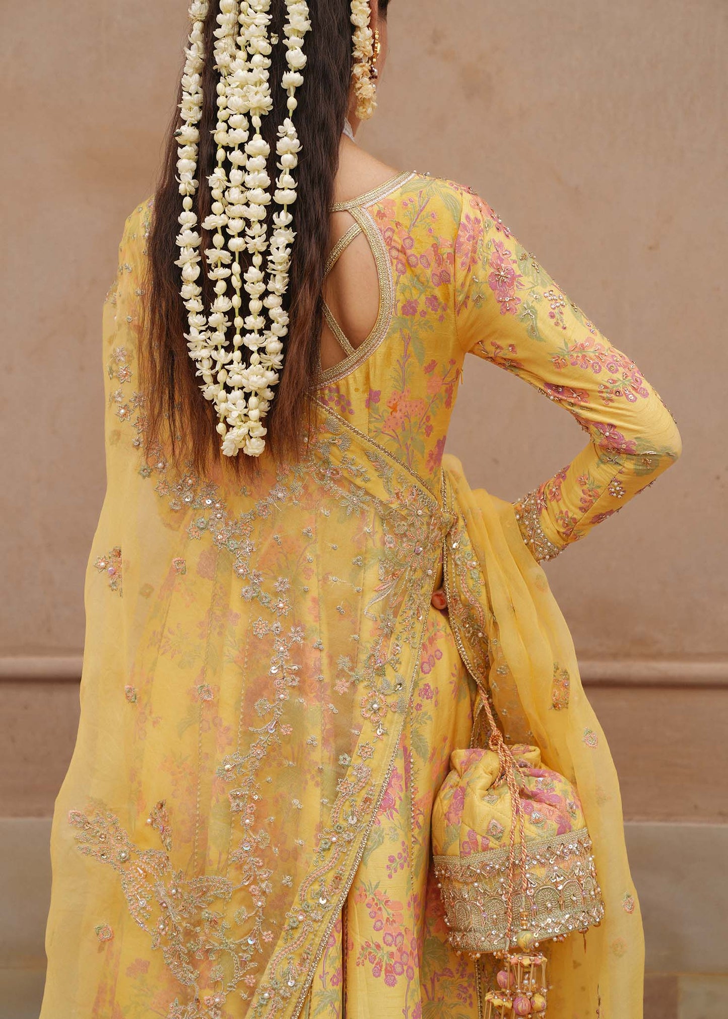 Model wearing Hoorain by Kanwal Malik in vibrant yellow with floral embroidery – festive Pakistani luxury pret outfit in UK.