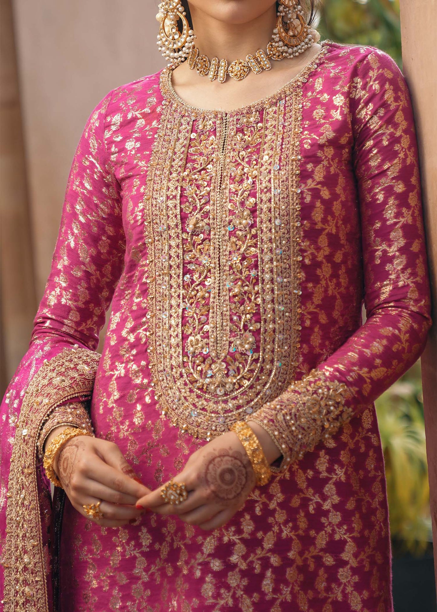 Model wearing Rano by Kanwal Malik in hot pink with intricate gold detailing – vibrant Pakistani luxury pret outfit in UK.