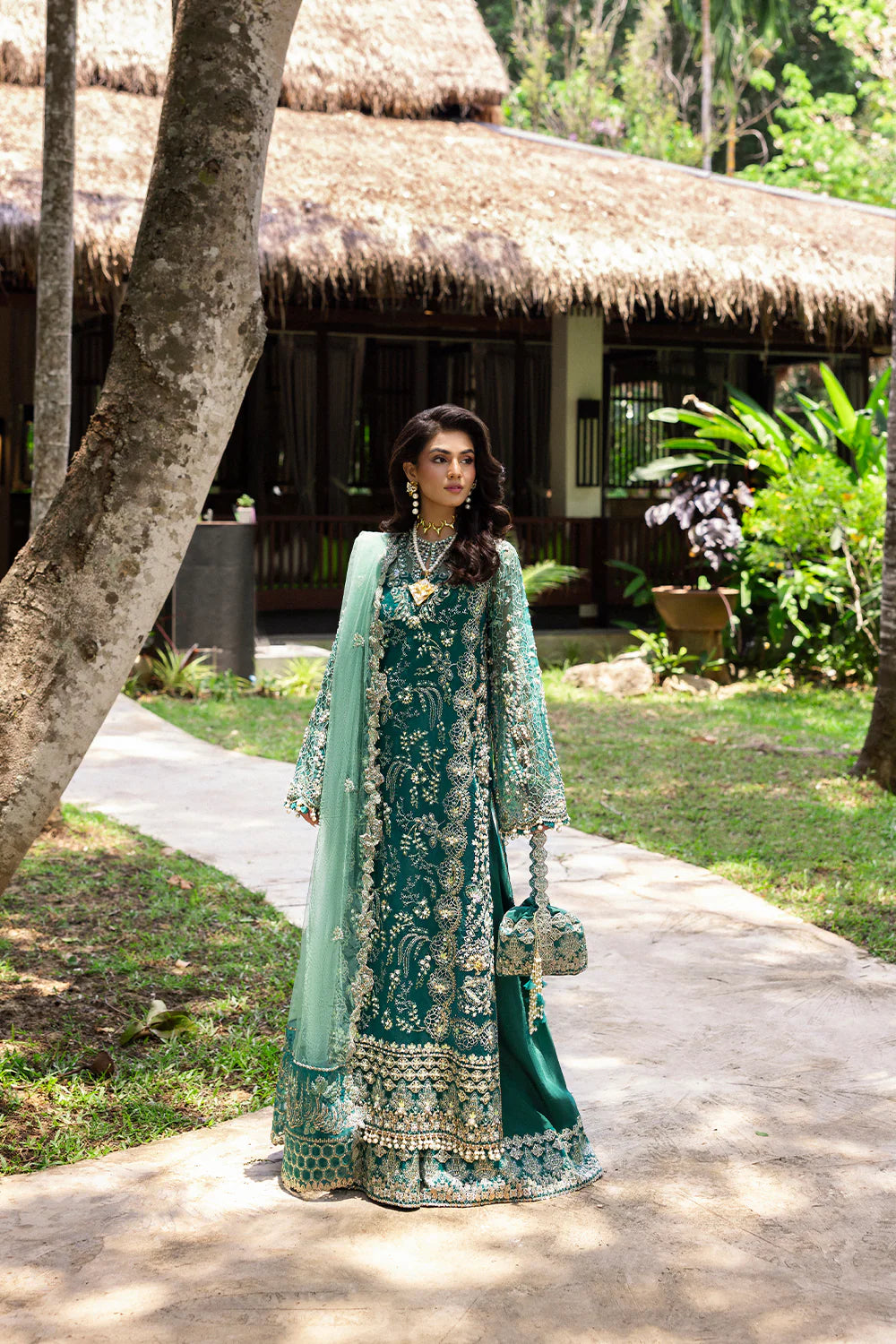Model wearing Saira Rizwan KIANA-SRF25-04 in emerald green with silver embellishments – Pakistani luxury pret, shop online in UK.