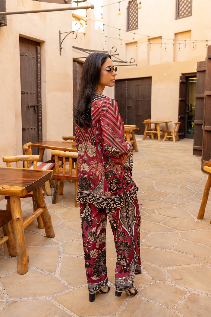 Model wearing maroon co-ord set with beige and black floral print from Saira Rizwan, Pakistani Luxury pret, Pakistani clothes online in UK.