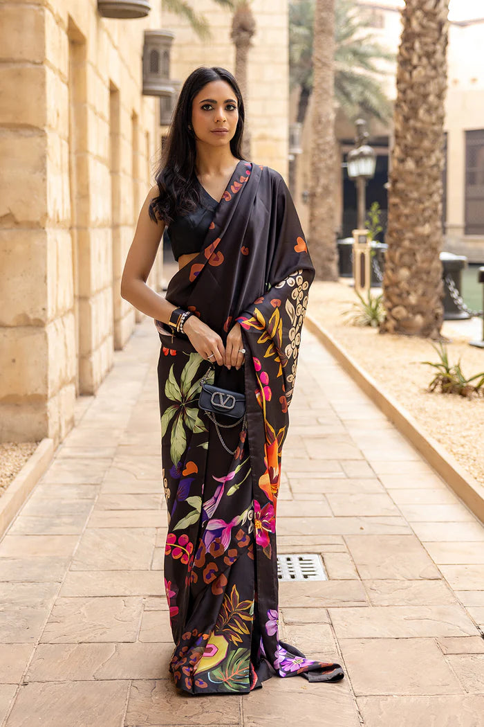 Model wearing black saree with multicolour heart and floral motifs from Saira Rizwan, Pakistani Luxury pret, Pakistani clothes online in UK.
