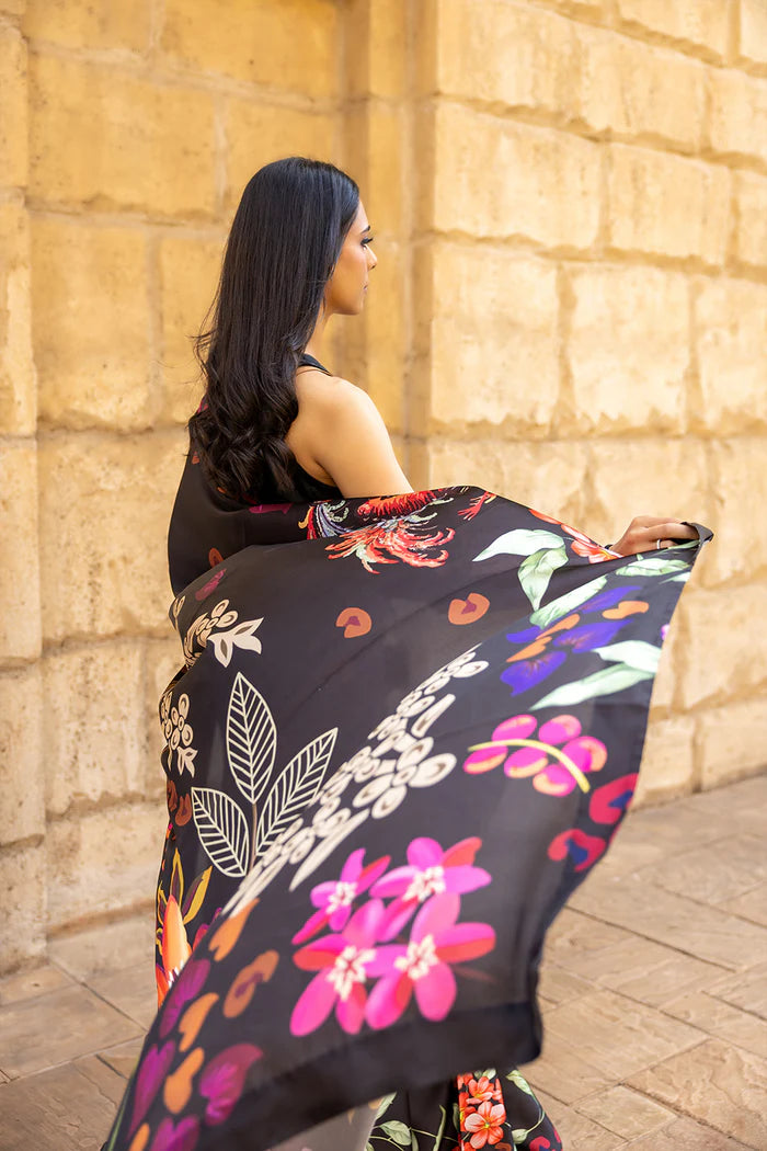 Model wearing black saree with multicolour heart and floral motifs from Saira Rizwan, Pakistani Luxury pret, Pakistani clothes online in UK.
