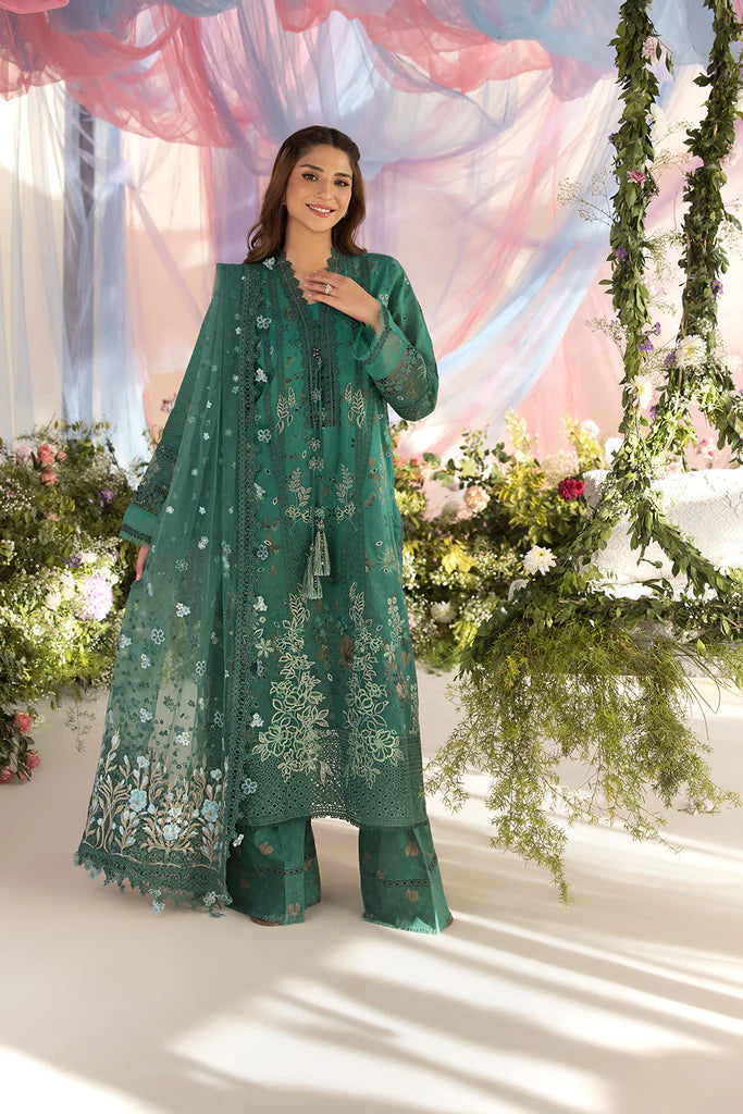 Model wearing Sobia Nazir Design 15B green luxury lawn dress with delicate embroidery. Shop Pakistani clothes online in the UK for casual and festive wear.