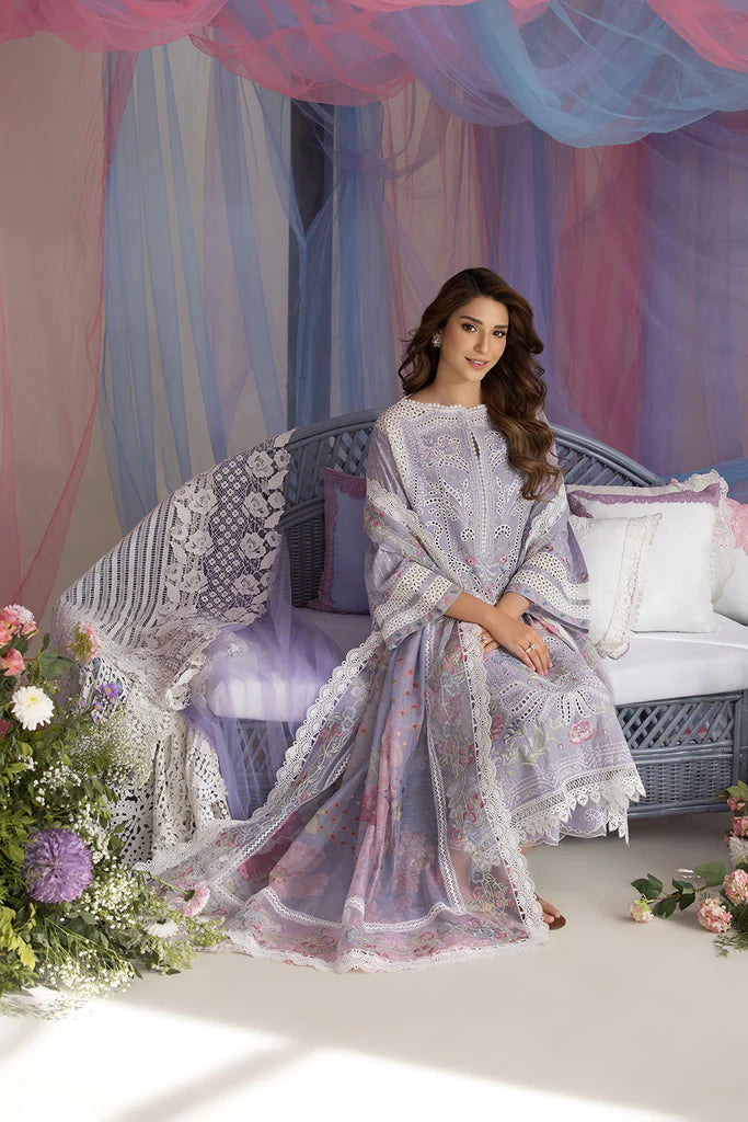 Model wearing Sobia Nazir Design 5A lilac luxury lawn dress with intricate embroidery. Shop Pakistani clothes online in the UK for casual and festive wear.