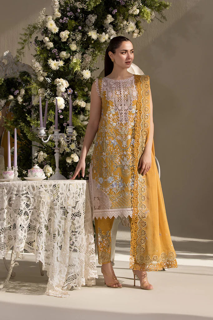 Model wearing Sobia Nazir Design 6B mustard yellow luxury lawn dress with intricate embroidery. Shop Pakistani clothes online in the UK for casual and festive wear.