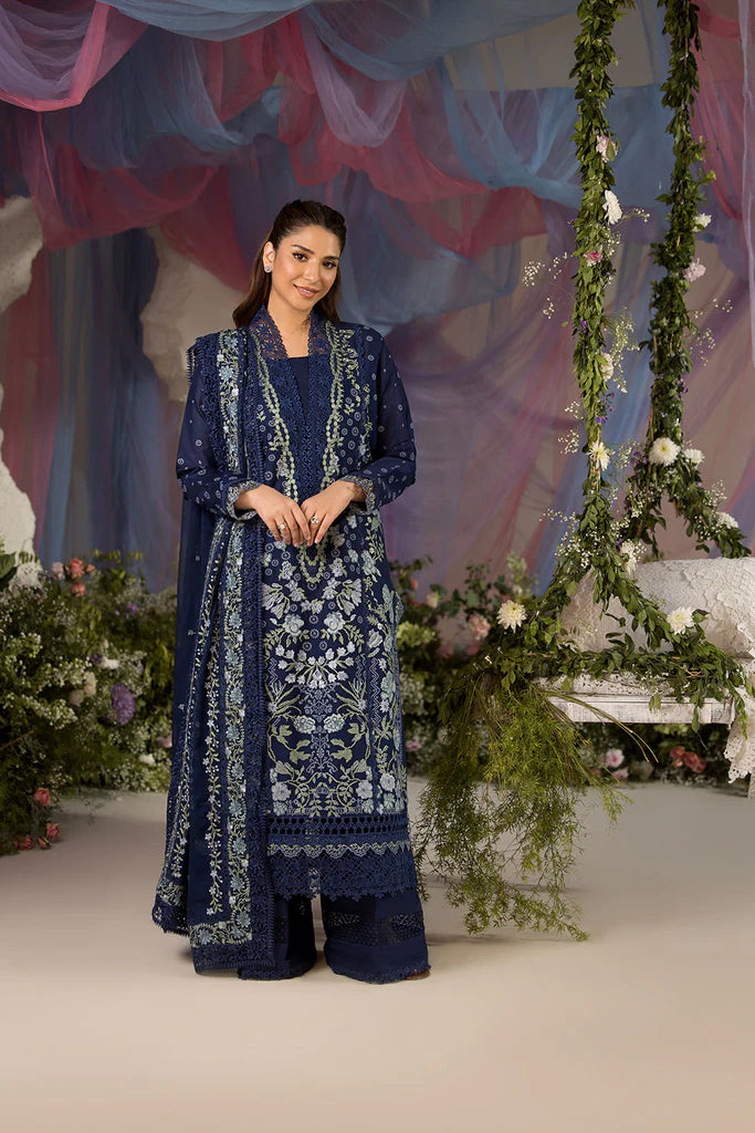 Model wearing Sobia Nazir Design 8A navy blue luxury lawn dress with intricate embroidery. Shop Pakistani clothes online in the UK for casual and festive wear.