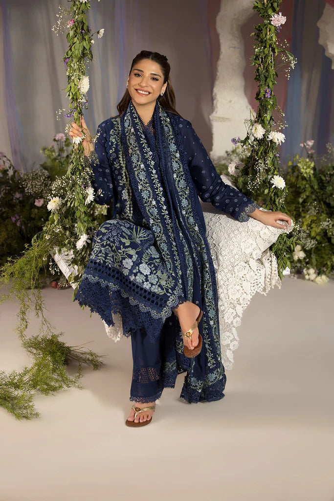 Model wearing Sobia Nazir Design 8A navy blue luxury lawn dress with intricate embroidery. Shop Pakistani clothes online in the UK for casual and festive wear.