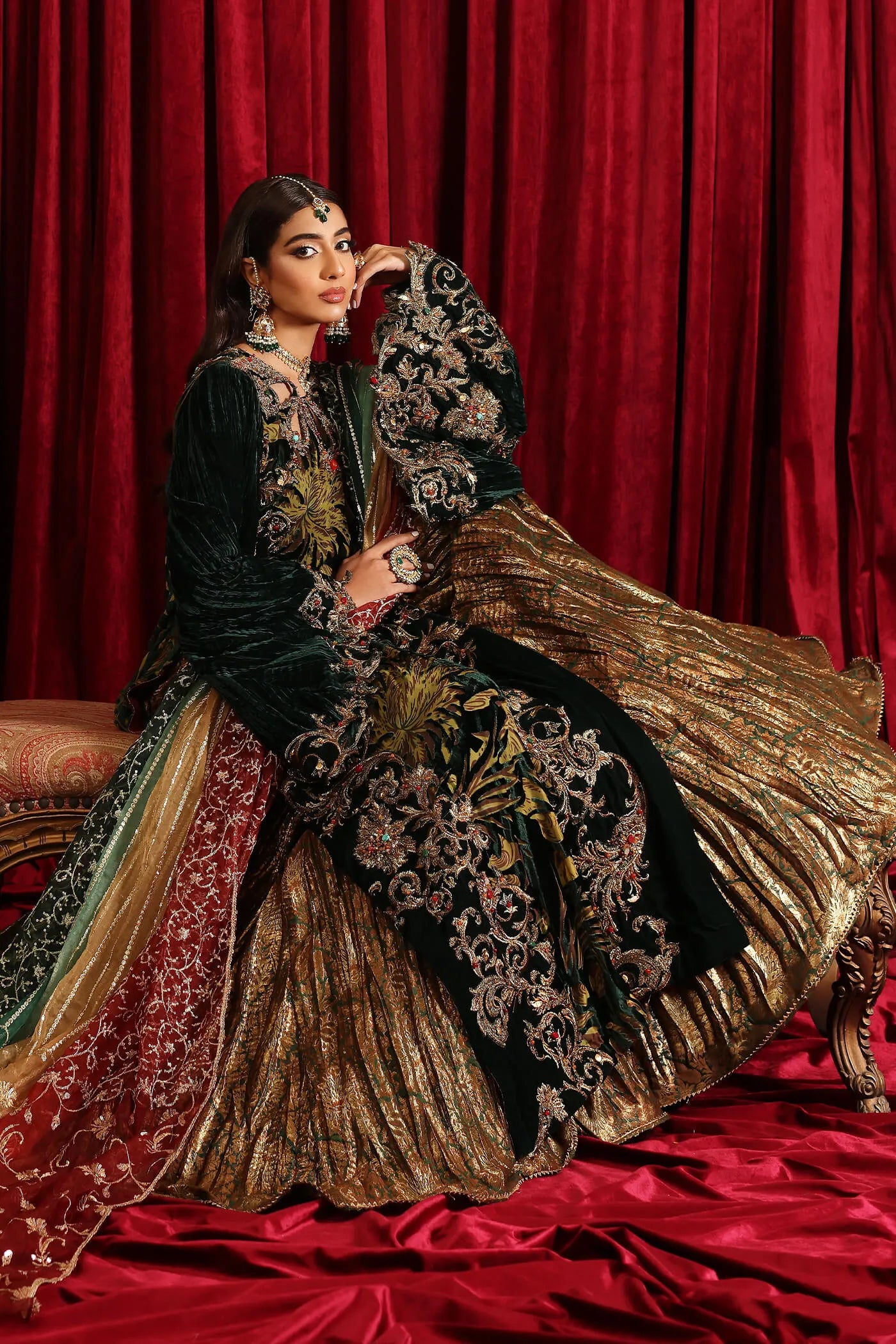 Model in Musferah Saad Radiant Spell, an emerald green Pakistani bridal dress in the UK.