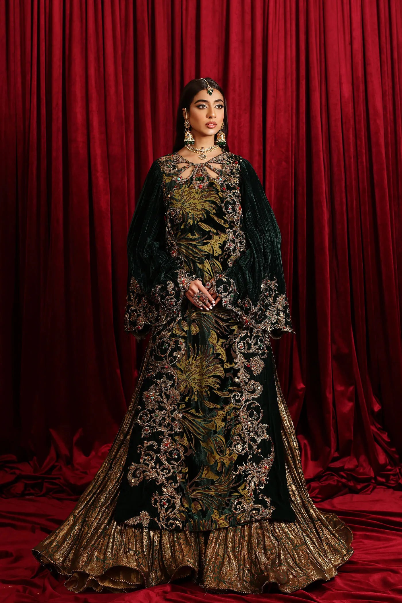 Model in Musferah Saad Radiant Spell, an emerald green Pakistani bridal dress in the UK.