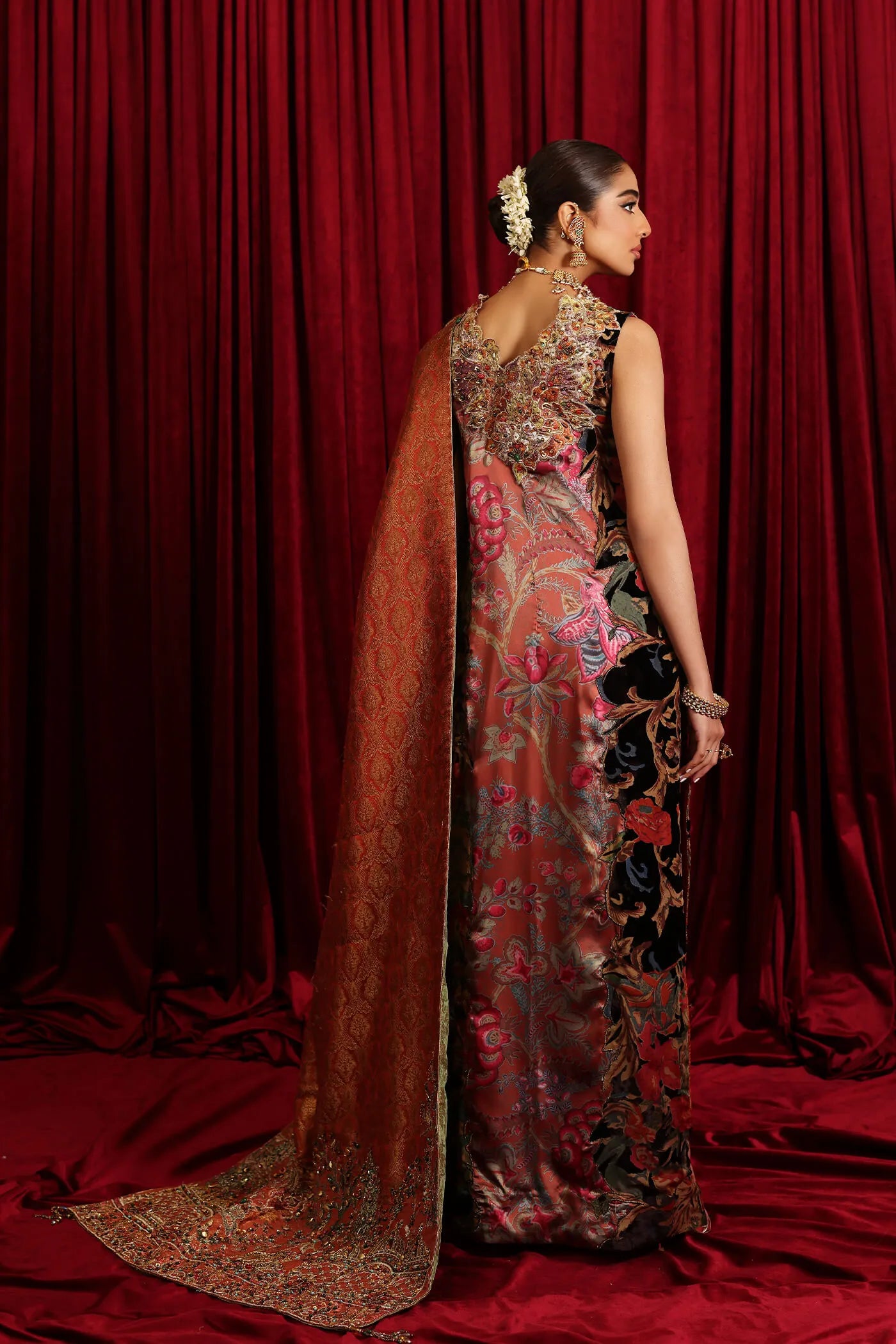 Model in Musferah Saad Sunstone Symphony, a rust Pakistani bridal dress in the UK.