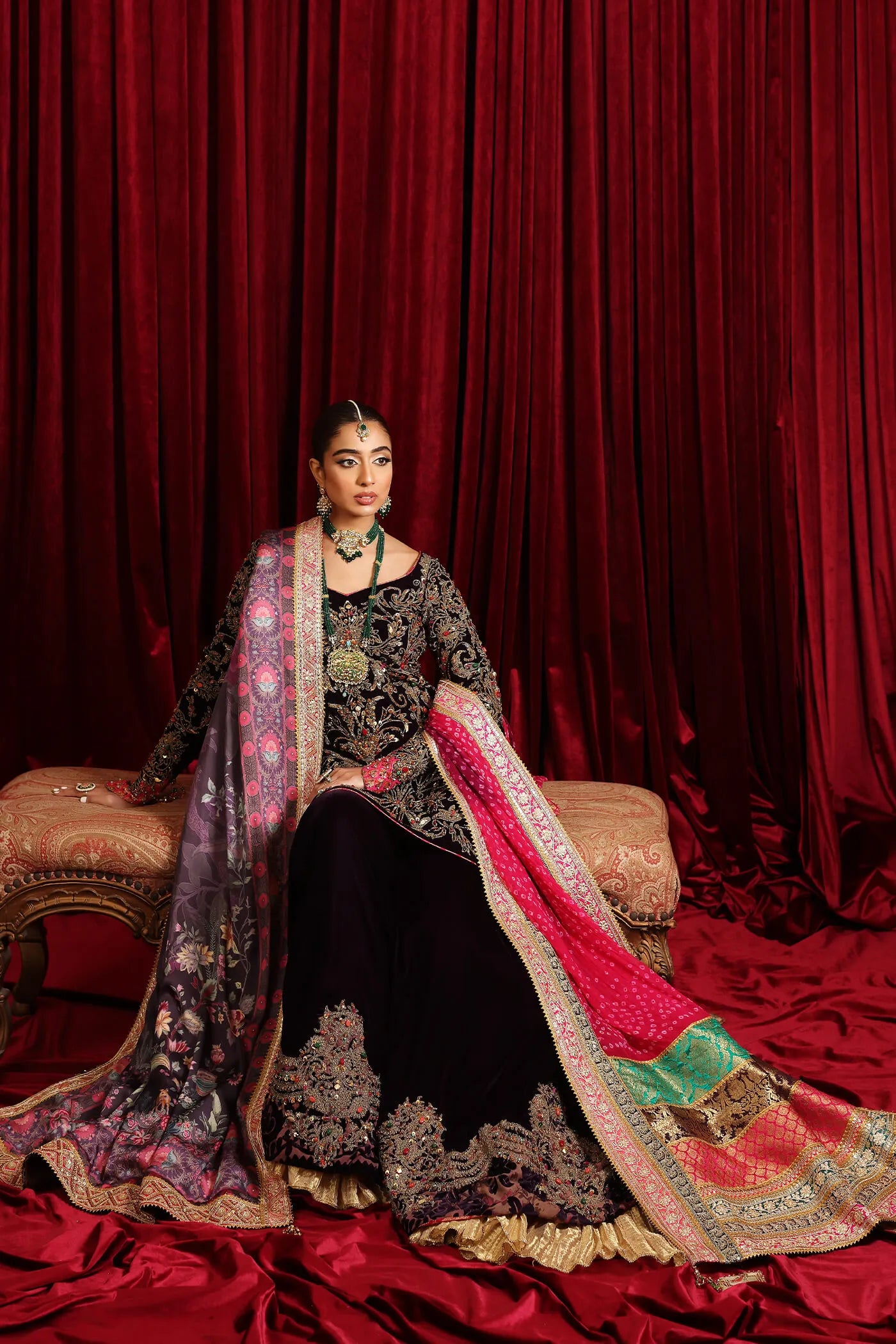 Model in Musferah Saad Velvet Symphony, opulent Pakistani bridal attire in UK.
