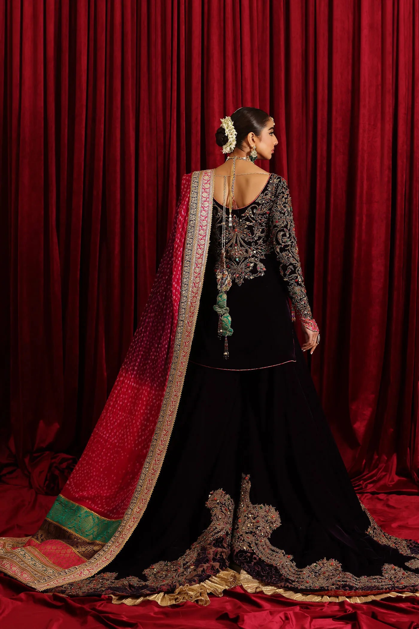 Model in Musferah Saad Velvet Symphony, opulent Pakistani bridal attire in UK.
