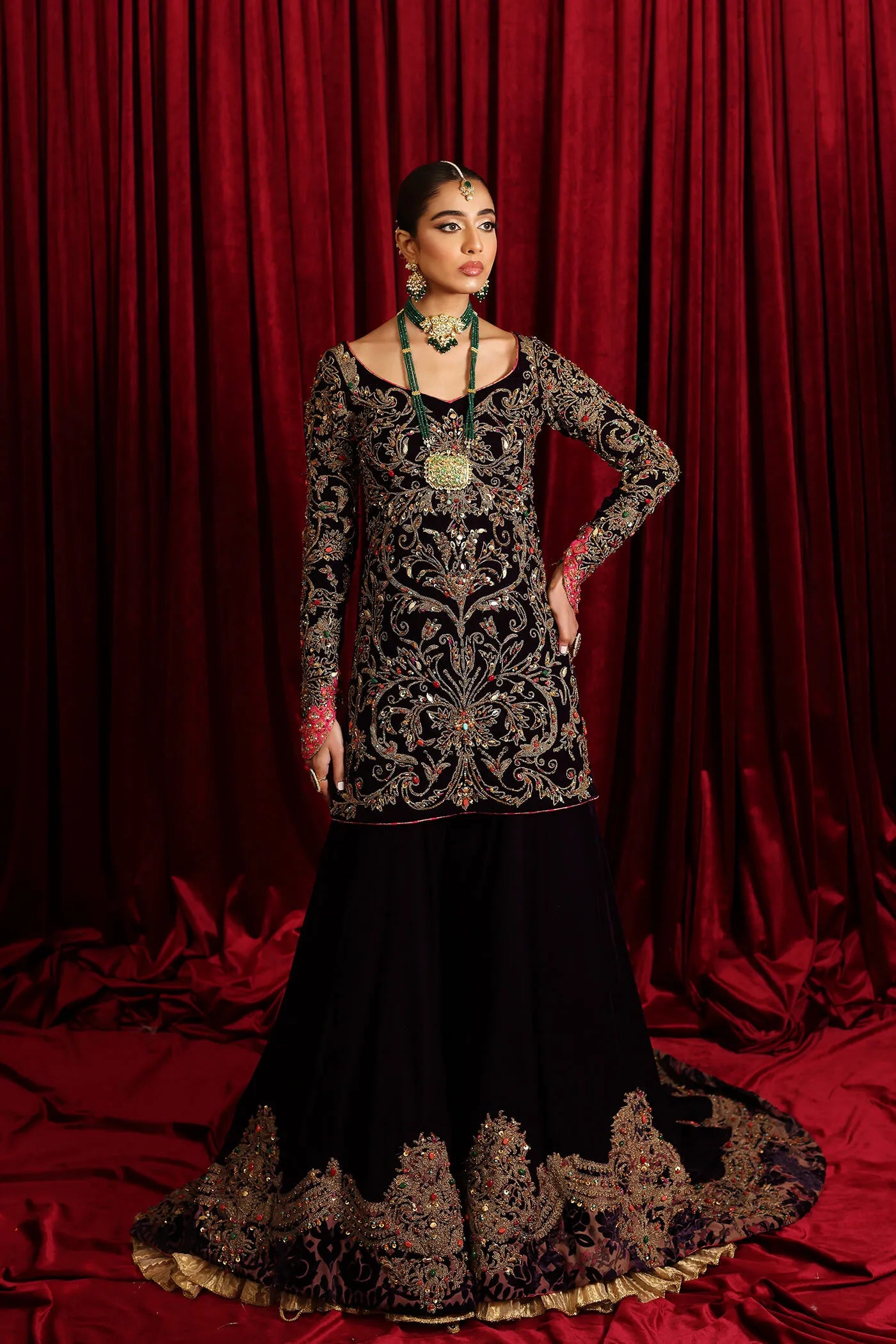 Model in Musferah Saad Velvet Symphony, opulent Pakistani bridal attire in UK.
