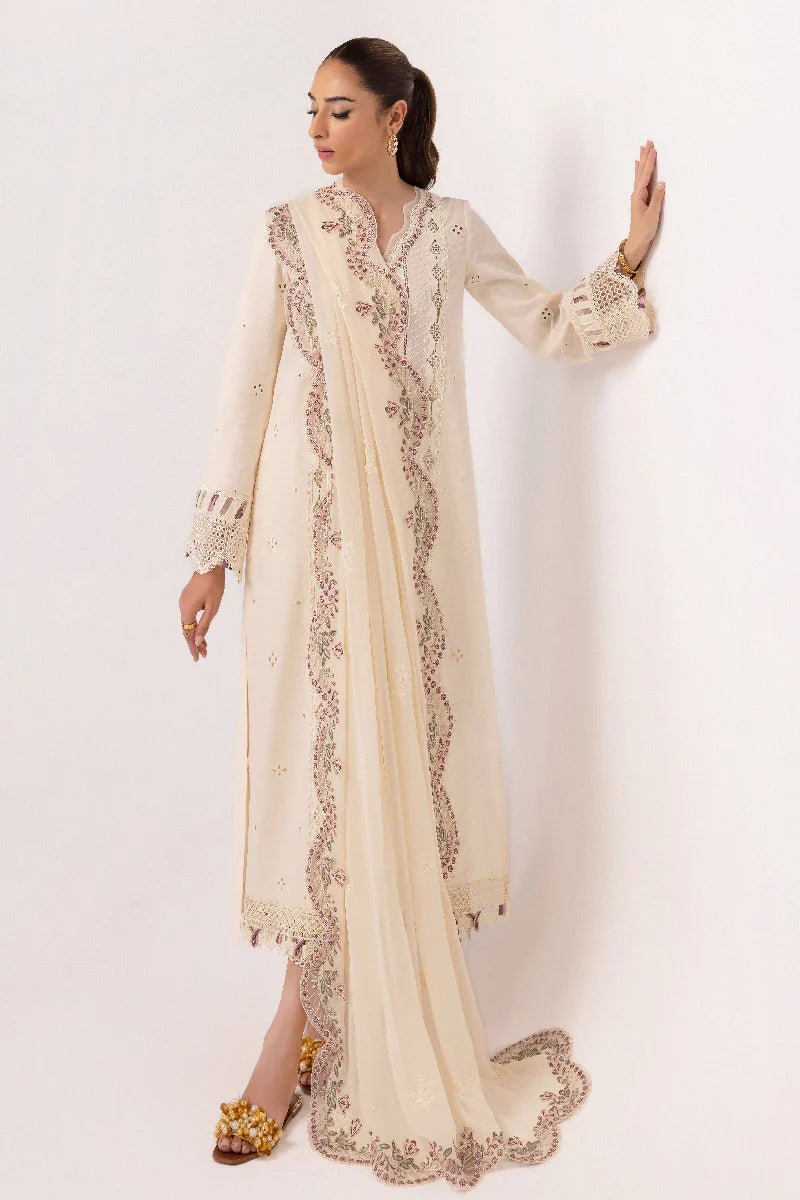 Model wearing ivory embroidered dress from Qalamkar Basic Pret '25 KT-01 Lverah, Saffron Pakistani Luxury pret available online in UK.