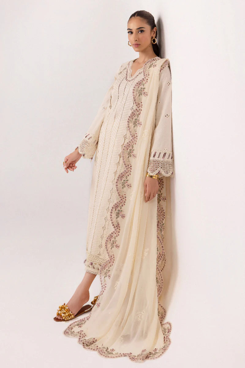 Model wearing ivory embroidered dress from Qalamkar Basic Pret '25 KT-01 Lverah, Saffron Pakistani Luxury pret available online in UK.