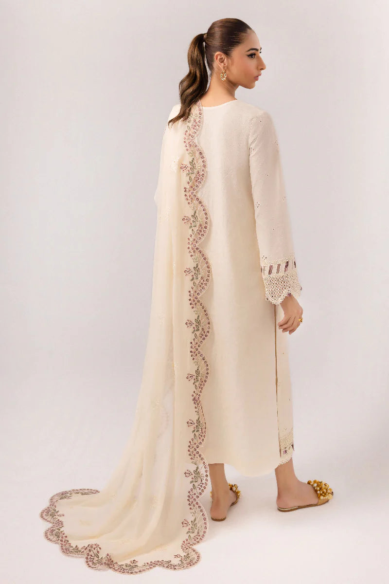 Model wearing ivory embroidered dress from Qalamkar Basic Pret '25 KT-01 Lverah, Saffron Pakistani Luxury pret available online in UK.