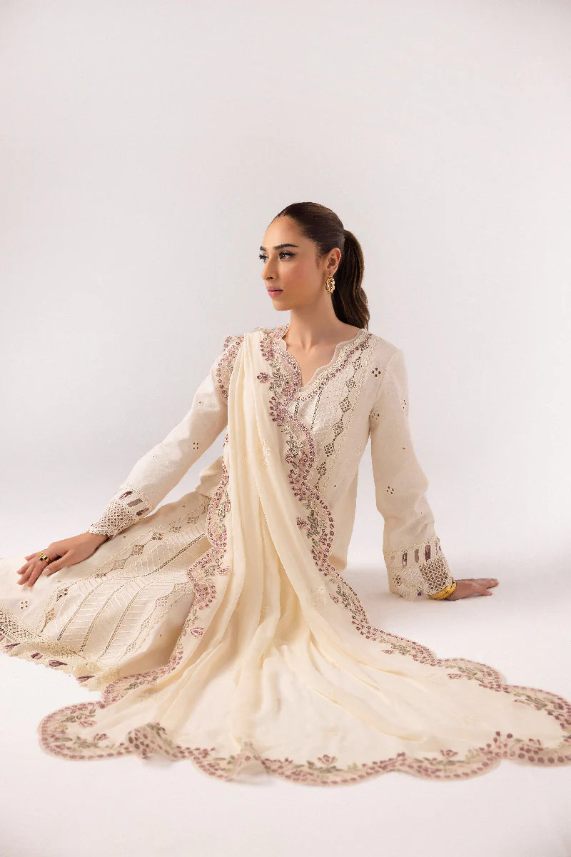 Model wearing ivory embroidered dress from Qalamkar Basic Pret '25 KT-01 Lverah, Saffron Pakistani Luxury pret available online in UK.