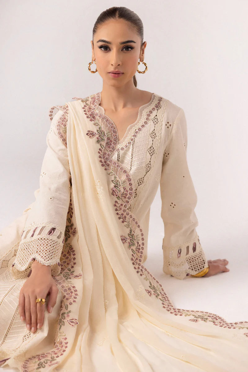 Model wearing ivory embroidered dress from Qalamkar Basic Pret '25 KT-01 Lverah, Saffron Pakistani Luxury pret available online in UK.