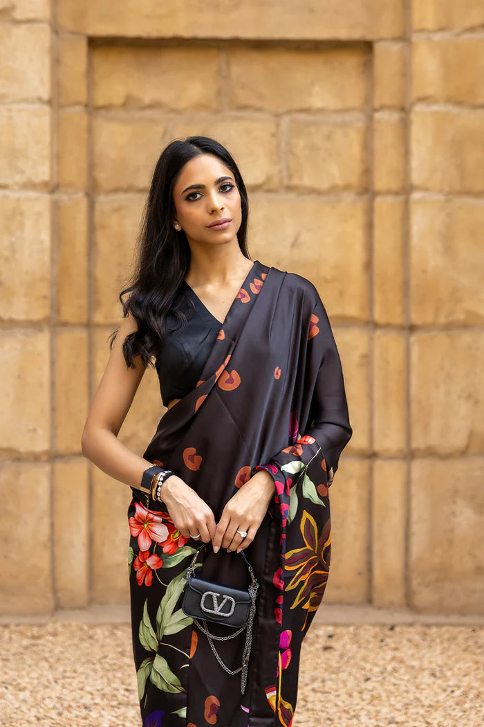 Model wearing black saree with multicolour heart and floral motifs from Saira Rizwan, Pakistani Luxury pret, Pakistani clothes online in UK.