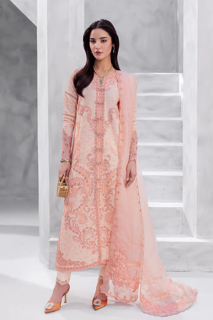 Model wearing peach pink Mitchelle from Mushq La Toscana Casual Pret '25, Pakistani luxury pret and Pakistani clothes online in UK.