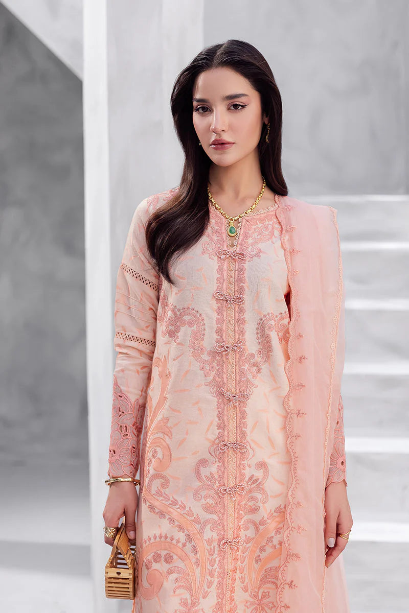 Model wearing peach pink Mitchelle from Mushq La Toscana Casual Pret '25, Pakistani luxury pret and Pakistani clothes online in UK.