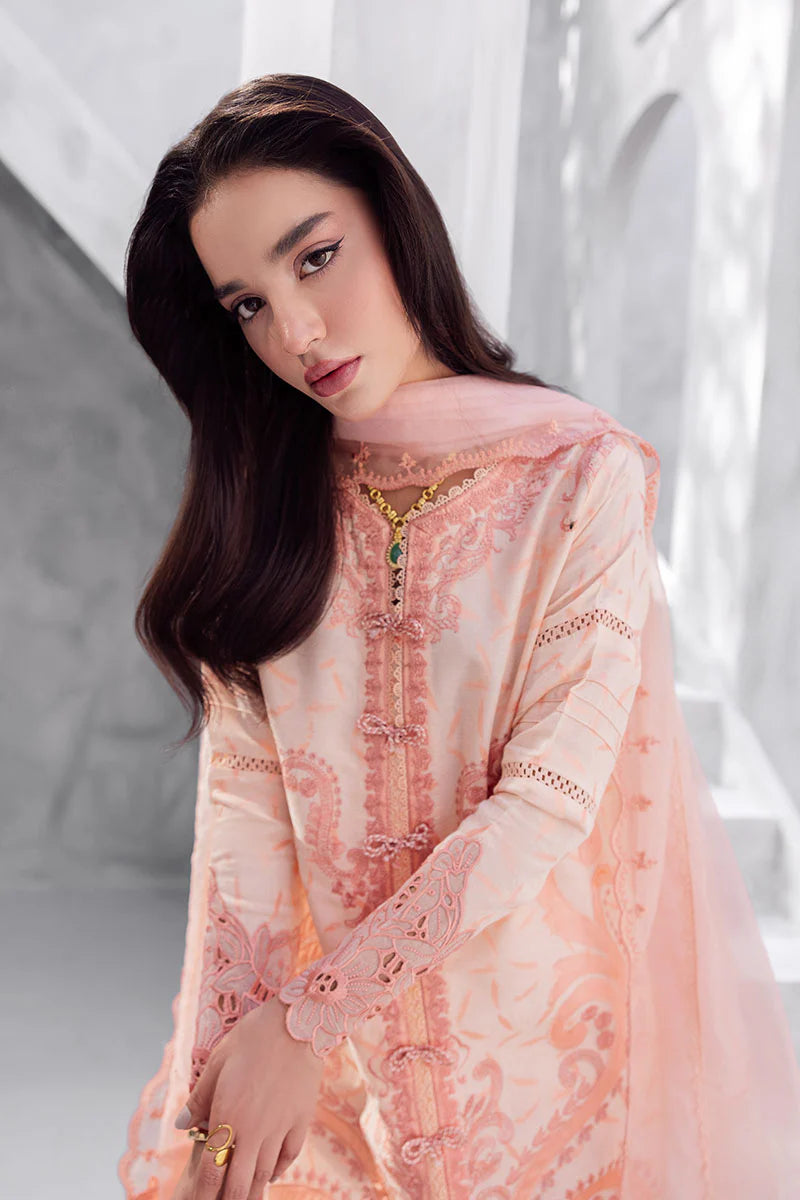 Model wearing peach pink Mitchelle from Mushq La Toscana Casual Pret '25, Pakistani luxury pret and Pakistani clothes online in UK.